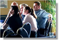 EPA Sustainable Industries, Director State Development, Planning and Environment Manager, Townsville Port Authority, and TCC Manager Financial Accounting, and Planning Program Facilitator, listen to a presentation.