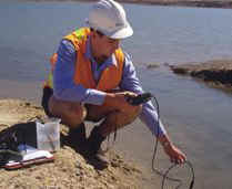 Craig Wilson testing water quality in the Eastern Port Development reclamation area.