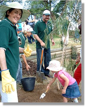 Previous Mayor Tony Mooney (center), and Previous Deputy Mayor Ann Bunnell (left), planting trees at Rossiter Park, part of the Greening Townsville Program 2005.