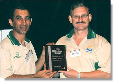 Luis Sanches and Martin Brewster with award