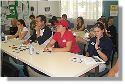 Volunteers pay particular attention to the guest speakers.