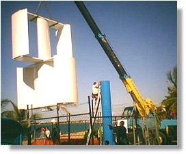 The twin wind-rotors are craned onto the tower.